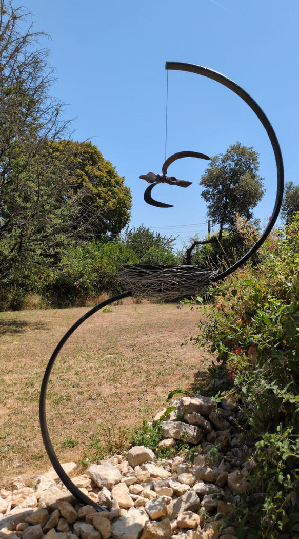 Salvaged agricultural sickles, forged steel axe head, hammerhead, steel wire. Component of a 2.4 m installation | Hanging sculpture